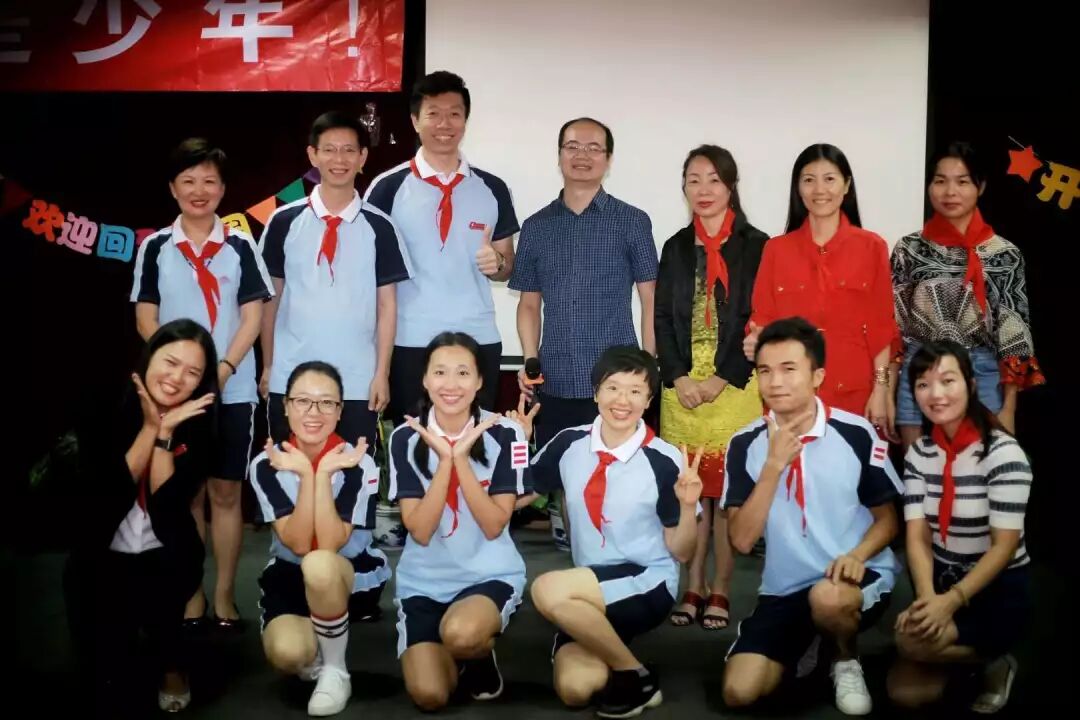 Red scarves, the kind Chinese schoolchildren wear.