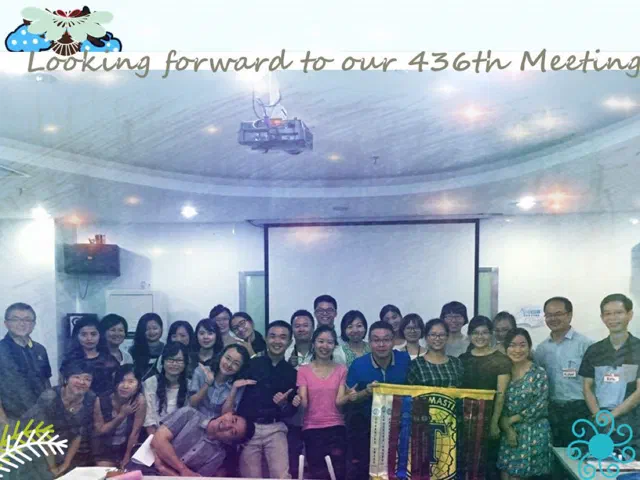 Around twenty-five people, one banner