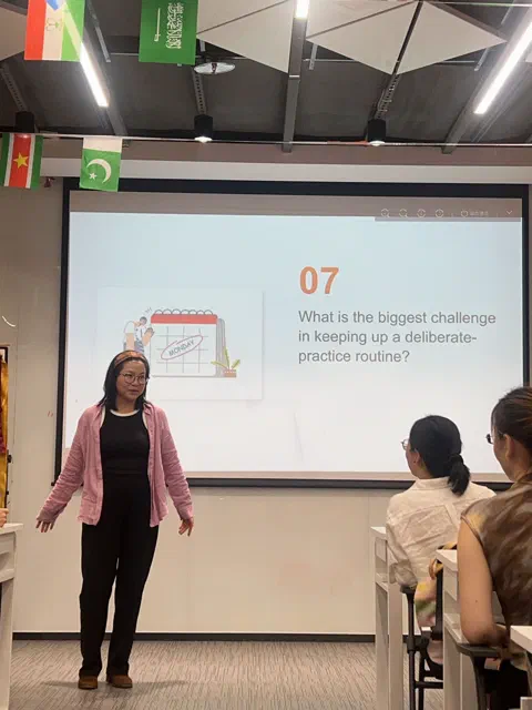 Christy answering a Table Topic.