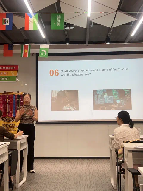 Tracy answering a Table Topic.