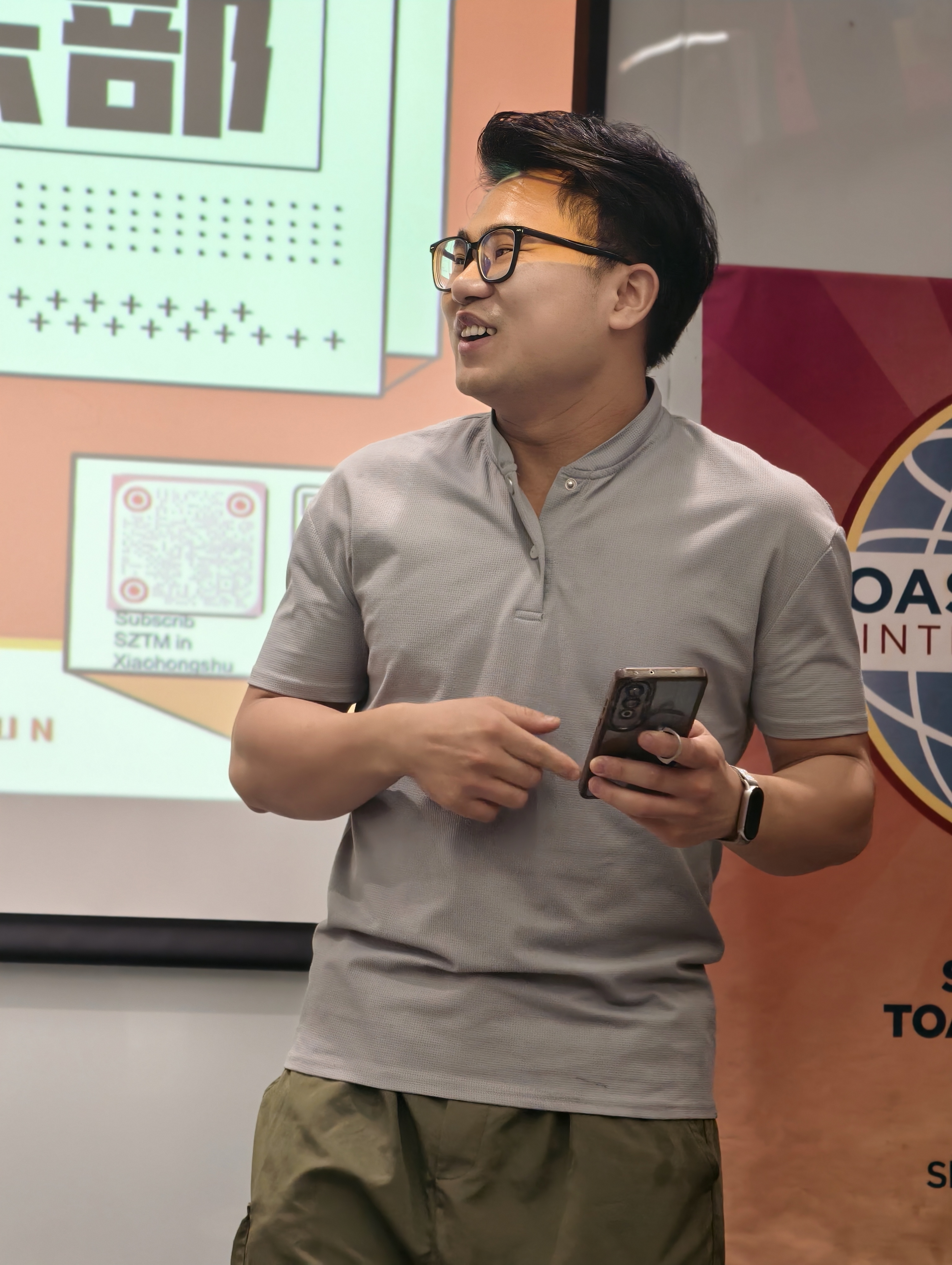 Tangson, phone in hand.