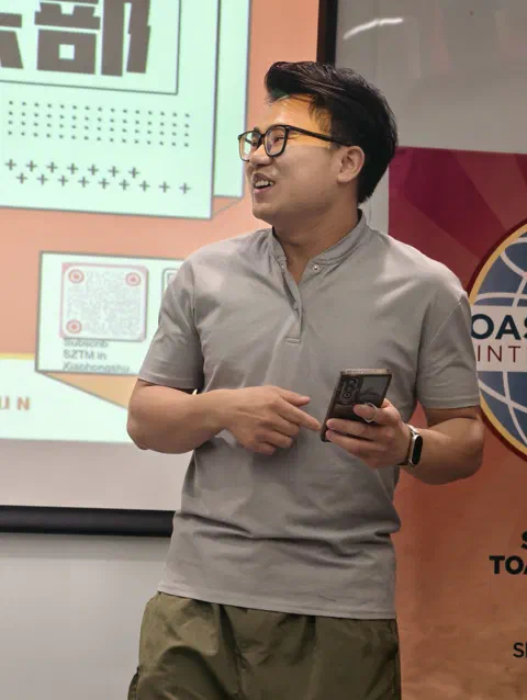 Tangson, phone in hand.