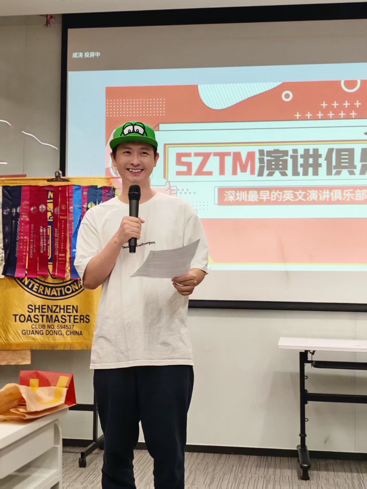 Tao, Toastmaster of the Evening, opening the meeting.