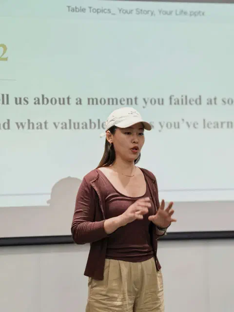 Cecilia answering a Table Topic.
