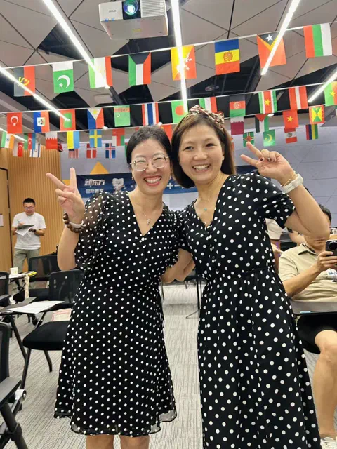 Stella and Anna in matching polka-dot dresses.