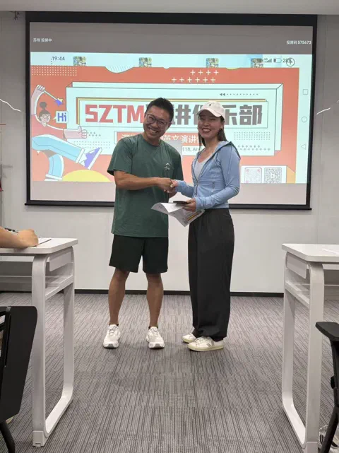 A handshake after a Table Topic.