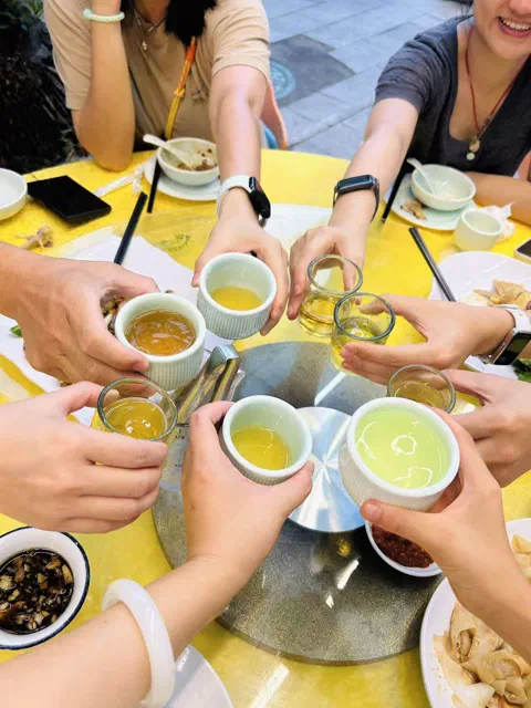 Cheers over hotpot.